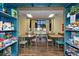 Fun game room with tables, chairs and shelves filled with board games and puzzles for enjoyment at 3755 Sanibel St, Clermont, FL 34711