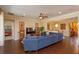 Spacious living room with a sectional sofa, hardwood floors, ceiling fan and access to other rooms at 3755 Sanibel St, Clermont, FL 34711