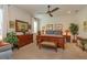 Main bedroom with a ceiling fan, a neutral color palette, and an ensuite bathroom at 3755 Sanibel St, Clermont, FL 34711