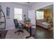 Home office space with hardwood floors and natural light, leading to the living room at 3755 Sanibel St, Clermont, FL 34711