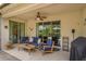 Relaxing screened patio with comfortable seating and easy access to the outdoors, perfect for leisure at 3755 Sanibel St, Clermont, FL 34711