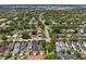 Sweeping aerial view of the community with mature trees and meticulously landscaped homes at 4001 Corrine Dr, Orlando, FL 32814