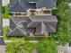 Overhead shot reveals backyard designs and landscaping of homes nestled among green foliage at 4001 Corrine Dr, Orlando, FL 32814