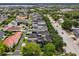 Aerial shot highlighting the orderly streetscape and rooftops amidst the natural landscape at 4001 Corrine Dr, Orlando, FL 32814