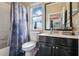 Well-lit bathroom with a shower/tub, decorative shower curtain, and a window at 4001 Corrine Dr, Orlando, FL 32814
