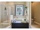 This bathroom features a shower, large tub, and black ottoman to bring the design together at 4001 Corrine Dr, Orlando, FL 32814