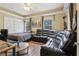 Comfortable room with a pull out bed, leather couches, and ample natural light at 4001 Corrine Dr, Orlando, FL 32814