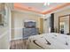 Comfortable bedroom with a TV, wood-look flooring, and a walkout exit at 4001 Corrine Dr, Orlando, FL 32814