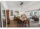 Elegant dining room with modern pendant lighting, stylish decor, and a sliding barn door into other living spaces at 4001 Corrine Dr, Orlando, FL 32814