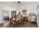 Elegant dining room with modern pendant lighting, stylish decor, and a comfortable rattan chair at 4001 Corrine Dr, Orlando, FL 32814