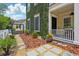 Attractive home exterior with vine-covered wall and stone pathway leading to a welcoming porch and cozy patio at 4001 Corrine Dr, Orlando, FL 32814