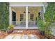 Inviting front porch with charming details and lush landscaping creates a welcoming entrance at 4001 Corrine Dr, Orlando, FL 32814