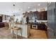 Well-equipped kitchen with an island and stainless appliances, seamless for cooking and entertaining at 4001 Corrine Dr, Orlando, FL 32814