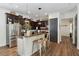 Bright kitchen with a granite countertop island, stainless steel appliances and pendant lighting at 4001 Corrine Dr, Orlando, FL 32814