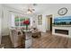 Inviting living room with plush seating, decorative fireplace, and lots of natural light at 4001 Corrine Dr, Orlando, FL 32814