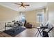 Spacious room with instruments, natural light, and wood-look flooring at 4001 Corrine Dr, Orlando, FL 32814