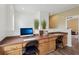 Bright office space featuring a built-in desk, modern decor, and a computer setup at 4001 Corrine Dr, Orlando, FL 32814