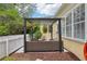 Charming outdoor patio with stylish seating under a pergola, providing a cozy space for relaxation at 4001 Corrine Dr, Orlando, FL 32814