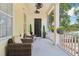 Inviting front porch with stylish seating and green accents, perfect for enjoying the outdoors at 4001 Corrine Dr, Orlando, FL 32814