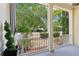 Charming outdoor porch area with well-manicured garden and beautiful plants, perfect for relaxing in a serene environment at 4001 Corrine Dr, Orlando, FL 32814