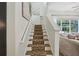 This staircase features leopard print carpet runner and white accents at 4001 Corrine Dr, Orlando, FL 32814