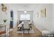 Bright dining room with modern chandelier, neutral decor, and a table with seating at 401 Magpie Ct, Kissimmee, FL 34759