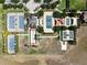 Aerial view of tennis courts and recreational facilities, providing ample opportunities for outdoor activities at 406 Alcove Dr, Groveland, FL 34736