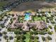 Stunning aerial view of community clubhouse, pool, and amenities, showcasing the luxurious lifestyle offered at 406 Alcove Dr, Groveland, FL 34736