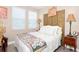 Charming bedroom with a comfortable bed, natural light, and tasteful decor creating a peaceful ambiance at 406 Alcove Dr, Groveland, FL 34736