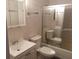 Bright bathroom featuring a classic white sink, toilet, and a shower with glass doors at 4061 Kirkland Blvd, Orlando, FL 32811
