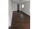 Clean and modern bedroom space featuring updated wooden floors and a bright, airy atmosphere at 4061 Kirkland Blvd, Orlando, FL 32811