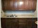 Kitchen cabinets showcase a classic style, complemented by the sleek granite countertops and modern sink at 4061 Kirkland Blvd, Orlando, FL 32811