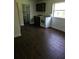 Cozy kitchenette featuring tile floors, basic appliances, and a practical layout at 4061 Kirkland Blvd, Orlando, FL 32811