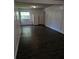 View of open living space, showcasing new flooring, neutral walls, and great natural light at 4061 Kirkland Blvd, Orlando, FL 32811