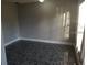 Gray room with black carpet and natural light at 4061 Kirkland Blvd, Orlando, FL 32811
