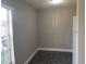 Gray room with black tiled floor and a window at 4061 Kirkland Blvd, Orlando, FL 32811