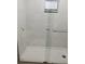Modern bathroom shower features white tiled walls and glass door at 4061 Kirkland Blvd, Orlando, FL 32811
