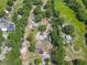 The aerial view of the home shows several garages/sheds with solar panels on the house at 4432 Freedom Rd, Kissimmee, FL 34746
