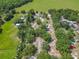 Sprawling rural property with mature trees and multiple structures, showcasing the estate's privacy and size at 4432 Freedom Rd, Kissimmee, FL 34746