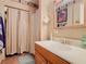 Bathroom featuring a shower with vanity, sink, and medicine cabinet at 4432 Freedom Rd, Kissimmee, FL 34746