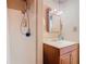 Bathroom with a shower and vanity sink with medicine cabinet at 4432 Freedom Rd, Kissimmee, FL 34746