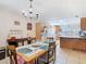 Cozy dining area adjacent to the kitchen, featuring a wooden table and ample natural light at 4432 Freedom Rd, Kissimmee, FL 34746