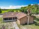 Charming single-story home with a screened porch and spacious yard in a serene, rural setting at 4432 Freedom Rd, Kissimmee, FL 34746