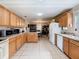 Extended kitchen with lots of counter space, modern appliances, and a view to dining area at 4432 Freedom Rd, Kissimmee, FL 34746