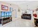 Inviting living room features vaulted ceiling, tile floors, and entertainment area at 4432 Freedom Rd, Kissimmee, FL 34746