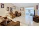 Inviting living room with tile flooring, comfortable seating, and views of the adjacent rooms at 4432 Freedom Rd, Kissimmee, FL 34746