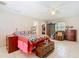 Bright main bedroom with neutral walls, ceiling fan and tiled floors, plus a large closet at 4432 Freedom Rd, Kissimmee, FL 34746