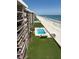 Aerial shot showcases pools, pristine beach, and ocean views from condo building; coastal living at its finest at 4453 S Atlantic Ave # 602, Ponce Inlet, FL 32127