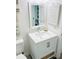 Clean and bright bathroom featuring a modern sink, vanity with storage, and a large mirror at 4453 S Atlantic Ave # 602, Ponce Inlet, FL 32127