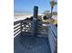 Community beach shower on a wooden deck with beach and ocean views at 4453 S Atlantic Ave # 602, Ponce Inlet, FL 32127